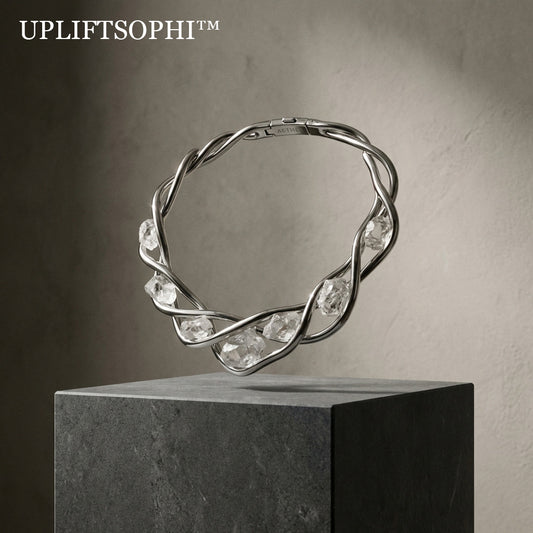 💎Upliftsophi™ THE AETHEL QUARTZ TORQUE "Fashion is the bridge between the earth and the architect. A structural collar engineered to entwine the wearer in a liquid flow of silver and raw, unpolished crystal."